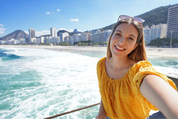 Brazilian girl enjoying takes self portrait on her vacation in Rio de Janeiro, Brazil
