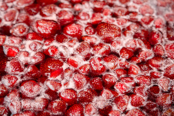 Strawberry jam, top view. Homemade Strawberry jam in making progress boiling. Boiling strawberry jam close up. Strawberry jam is boiling, detailed shooting.