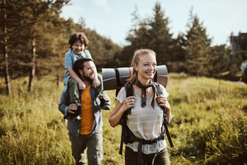 Young family hiking in the forest