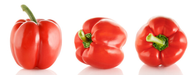 Group of red sweet peppers isolated on white background. Three sweet bell peppers. Close-up