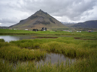 Small pond by Arnarstapi fishing village on Snæfellsnes Peninsula, West Iceland.