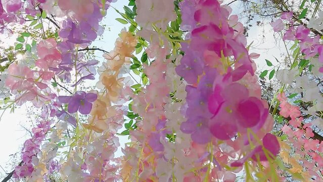 Artificial flowers blossoms.
A bright bouquet of pink Cherry and Sakura blossoms in park.