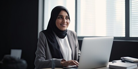 Smiling happy BIPOC businessman executive CEO in a business suit and Hijab using a computer to work with a client in an office setting -room for copy text, generative AI