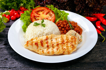 Rice beans grilled chicken steak salad, farofa