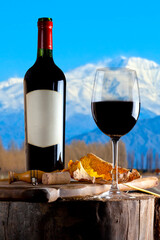 Glass and bottle of red wine cloud