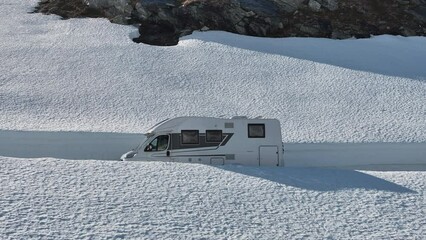 Modern RV Driving in Snow Corridor - Powered by Adobe
