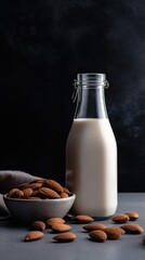 Vegan lactose free almond milk in glass bottle with almonds. 
