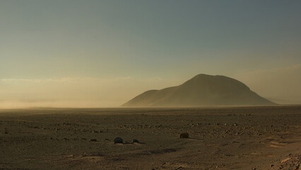 Fototapeta na wymiar Upcoming sandstorm. Wandering around the Atacama Desert. 