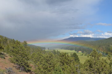 Fototapeta na wymiar landscape of the mountains and rainbow
