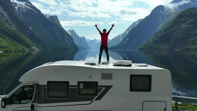 Tourist Feeling Excited While Enjoying Beautiful Norwegian Landscape.