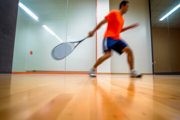 A racquetball hitting the corner of the court at high speed, illustrating the precise timing and strategy in the game