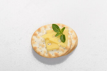 snack of blacha with cheese, decorated with basil leaf