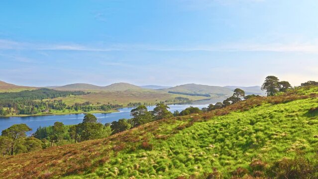 Loch Tulla and its spectacular surrounding hills and meadows on a picturesque sunny spring morning, Bridge of Orchy, West Highland Way, Scotland