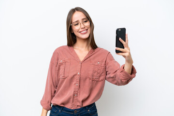 Naklejka premium Young pretty caucasian woman isolated on white background making a selfie