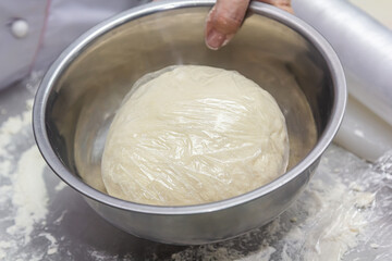 A dome of flour and eggs to be mixed to form some fresh pasta