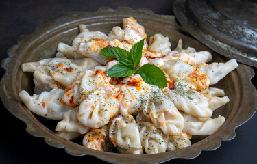 Traditional manti food on plate, top view. The concept of oriental cuisine. Uzbek food manty...