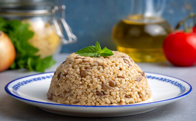 Traditional delicious Turkish foods; bulgur pilaf with green lentils (Turkish name; yesil mercimekli bulgur pilavi)