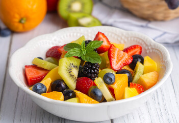 Fototapeta na wymiar Fruit salad made from summer fruits