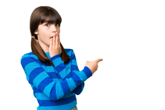 Little caucasian girl over isolated background with surprise expression while pointing side