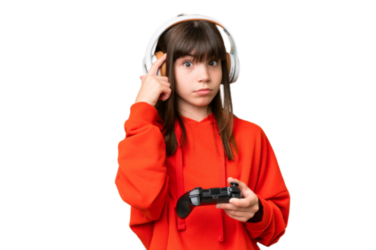 Little caucasian girl playing with a video game controller over isolated background thinking an idea