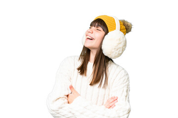Little caucasian girl wearing winter muffs over isolated background happy and smiling