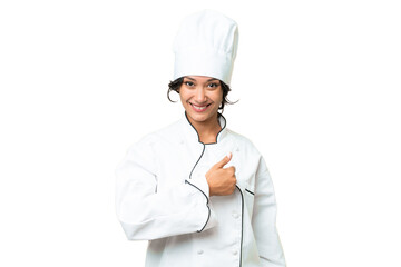 Young chef Argentinian woman over isolated background giving a thumbs up gesture