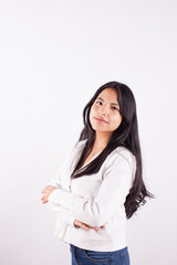 Portrait of young latina woman with crossed arms on light background of photo studio. Concept of people.