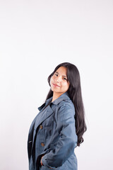 Portrait of young attractive hispan woman on a light background of photographic studio. Concept of people.