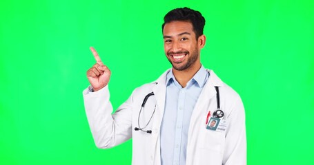 Pointing, feedback and doctor with man on green screen for advertising, deal and idea. Healthcare, medical and medicine with portrait of person on studio background for presentation, review and news