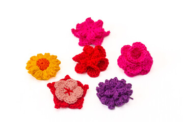 group of colorful flowers crocheted as hair clips