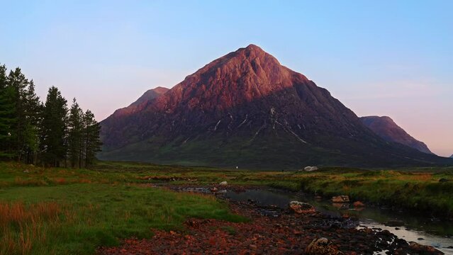 River Etive flowing towards majestic mountain sunrise of Buachaille Etive Mor in the Scottish Highlands, West Highland Way, Scotland