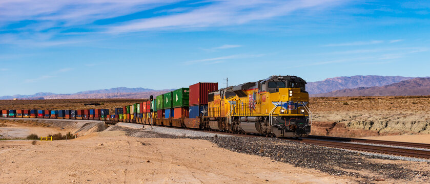 Palm Springs, USA  - January 22 2018 : Union Pacific Cargo train passing by the desert in Palm Springs.