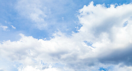 Scenic of white cumulus clouds floating above blue sky. Forecast cloudscape before rain in bright day, panoramic beauty scenery of nature. Abstract outdoor environment, white cloudy background