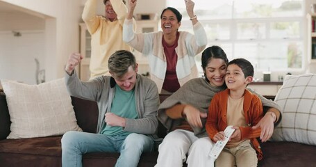 Watching tv, big family and living room cheer with mom, dad and children together on a sofa with care. Home, game celebration and kids on a lounge couch feeling happy with support for sport win