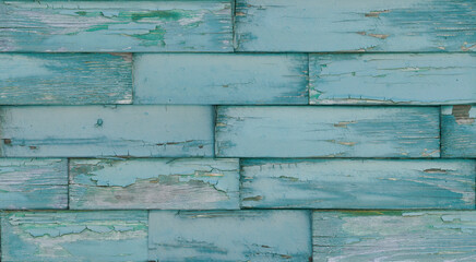 Obraz premium Crackled paint finish on blue green rustic wood planks. Aged reclaimed barn wood.