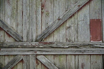 Crackled paint finish on white wood planks. Aged reclaimed barn wood.
