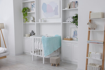 Fototapeta na wymiar Bedroom interior with stylish crib for newborn baby