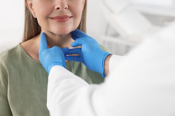Endocrinologist examining thyroid gland of patient indoors, closeup - obrazy, fototapety, plakaty