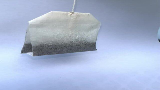 An unused tea bag spinning.