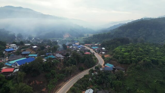 Mystical Beauty Unveiled: Mesmerizing Drone Footage of Lahu Village Embraced by Enigmatic Fog.