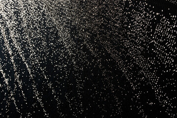 Abstract reflections of water vibrating on a conveyor belt