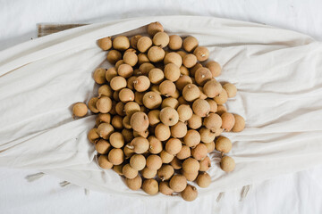 fresh longan with leaf isolated on white background. Flat lay