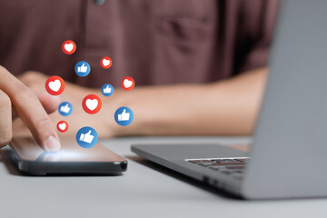 Businessman using smartphone with social media and social network.