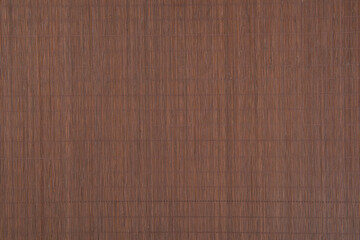 Texture of dark brown bamboo mat.Bamboo fine tablecloth background.