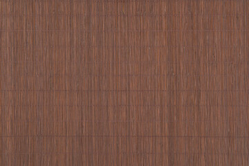 Texture of dark brown bamboo mat.Bamboo fine tablecloth background.