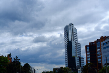 Fototapeta na wymiar Skyward Heights: Majestic Office Tower Embracing Bogota's Dramatic Skyline