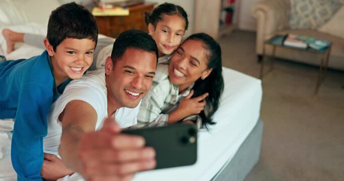 Selfie, phone and family together on bed for happy portrait, memory and social media post of bonding, quality time or weekend. Morning with dad, mom and children in bedroom waking up and relaxing
