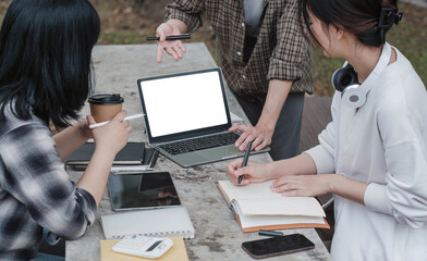 Group of Student working on laptop and record in book together at university. Happy friend...