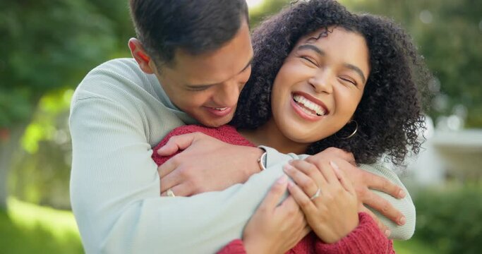 Love, smile and hug with a married couple in the garden of their home together for romance during summer. Spring, date and smile with happy young people in the backyard while bonding in spring