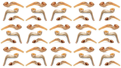 Many shofars on white background. Pattern for Rosh Hashanah (Jewish New Year)